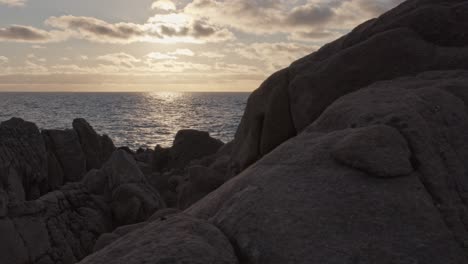 Reveal-shot-of-ocean-at-sunset