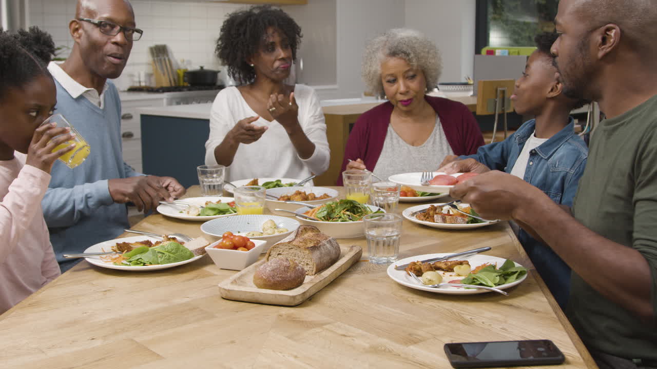 Family Taking a Selfie Together During a Family Dinner 