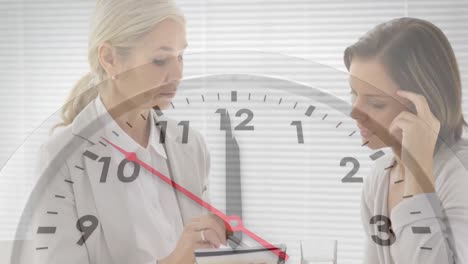 animation of clock ticking over diverse businesswomen in office