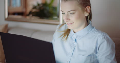 smiling woman working on laptop at home office businesswoman typing on computer keyboard 12