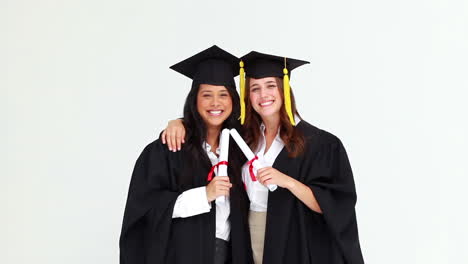 happy graduated students talking to each other