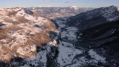 aerial - beautiful snowy winter in the mountains, kolasin, montenegro, reverse tilt up