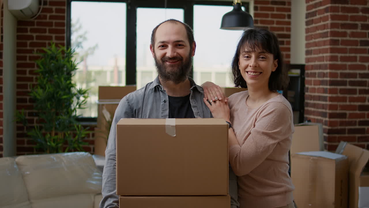 Portrait of relationship people with cardboard boxes to move in