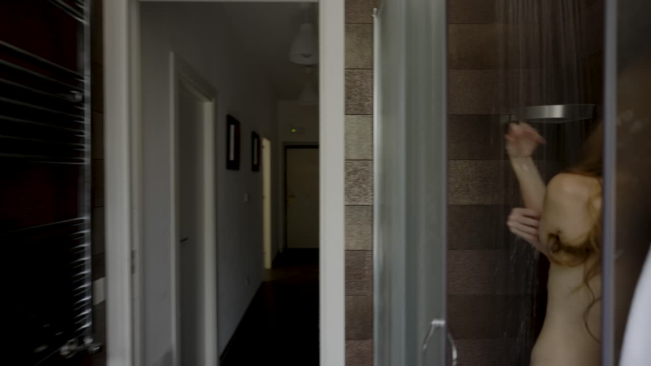 beautiful woman showering in her bathroom - closeup shot