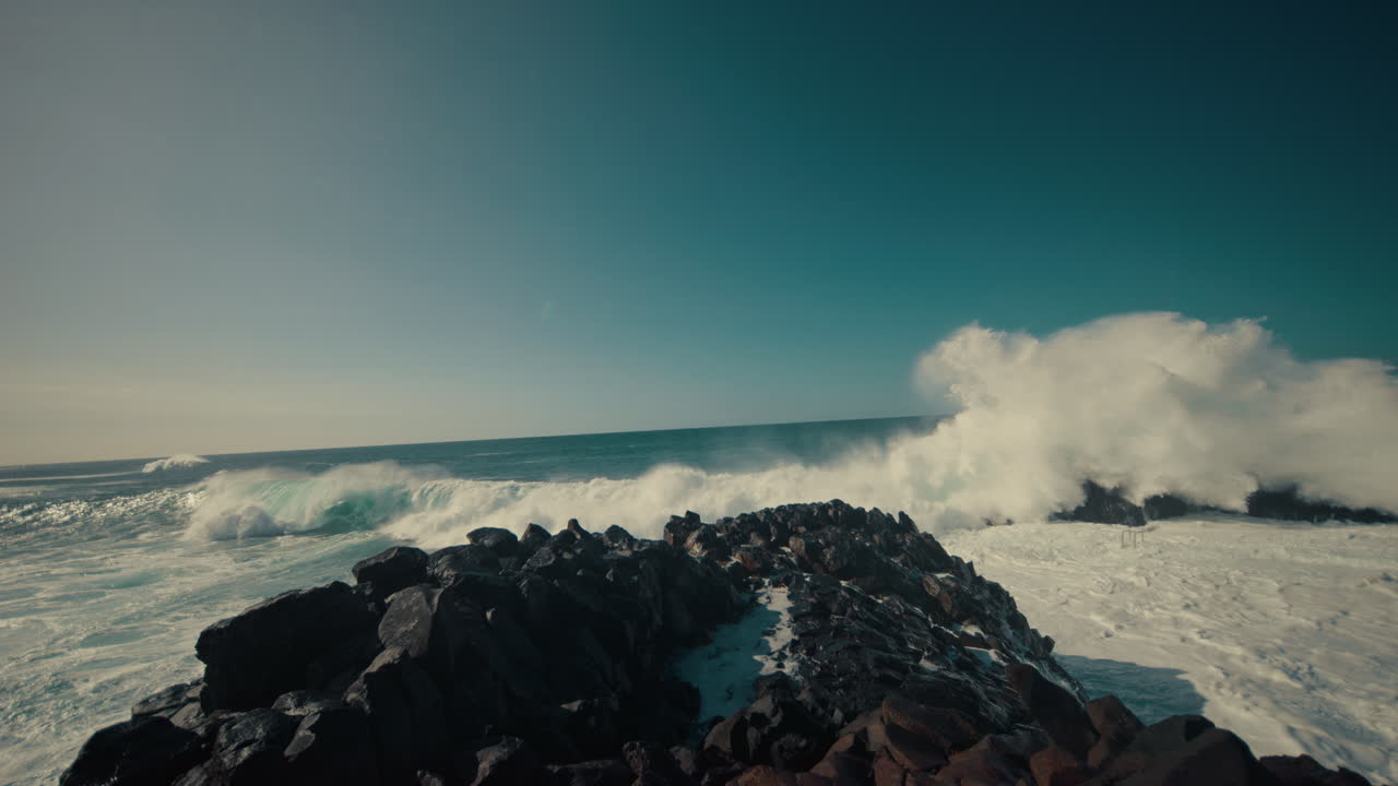 Powerful Waves Crashing on Rocky Coastline