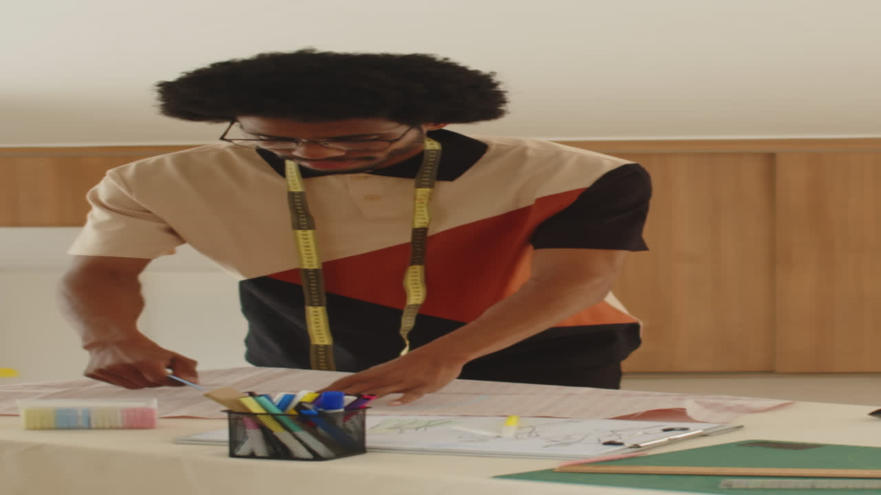 Male Tailor Marking Piece of Fabric before Sewing Dress