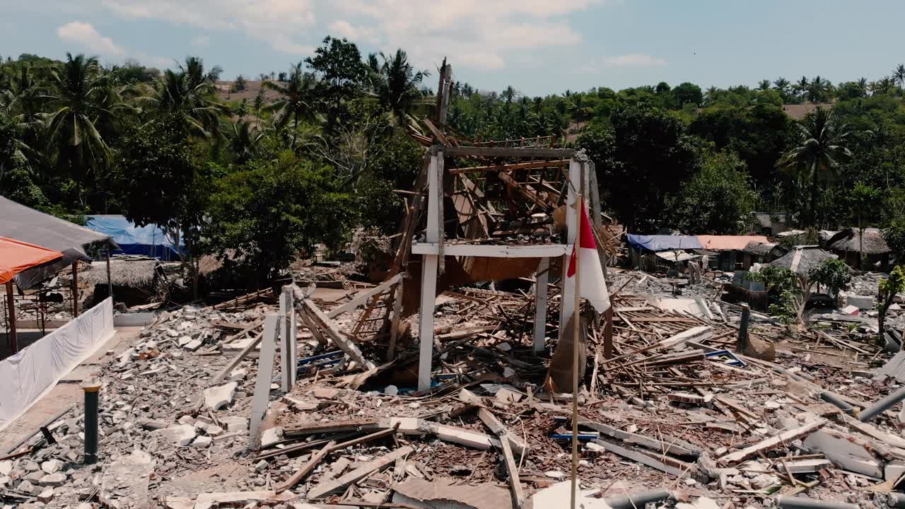 A cinematic aerial shot of the damage done by the earthquake in north Lombok, Indonesia.