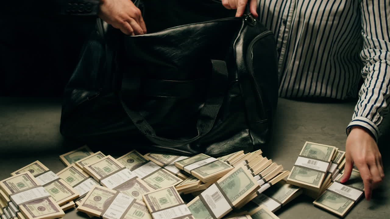 Specialised police officer Counting dollar banknotes in crime lab, conceptual image. High quality 4k footage