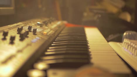 old fashiones midi piano keybord covered in smoke