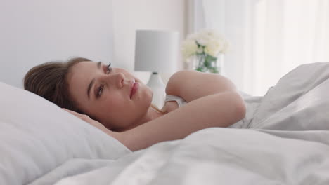 beautiful woman using smartphone texting lying bed browsing social media messages enjoying sharing relaxing weekend at home