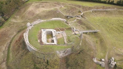 rotating drone view of ruins at bailey gate and castle acre