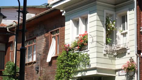 old traditional house with flowers in front of the building in the city