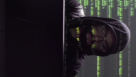 male hacker or programmer working on a computer
