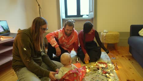 family celebrating christmas with baby