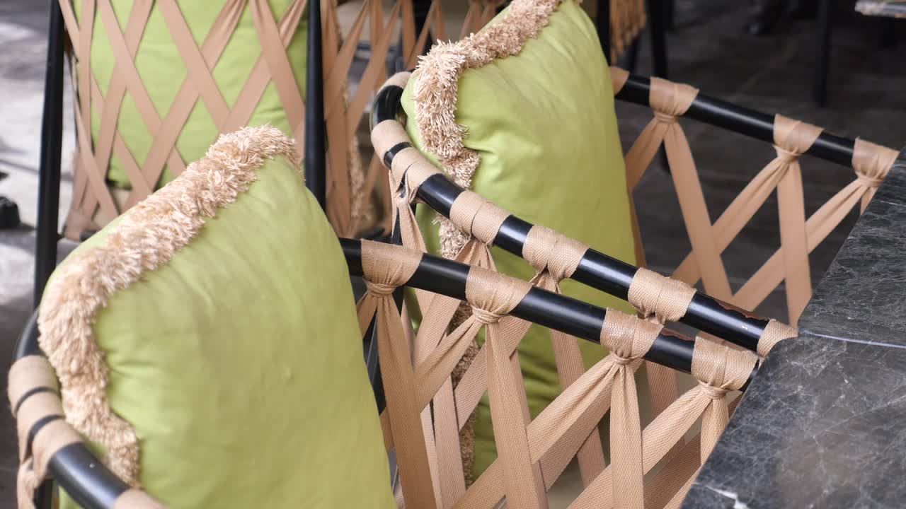 Outdoor Restaurant Chairs with Beige Straps and Green Cushions