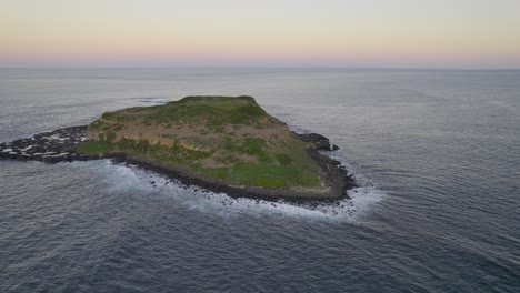 cook island in the middle of the sea during sunrise in new south wales, australia