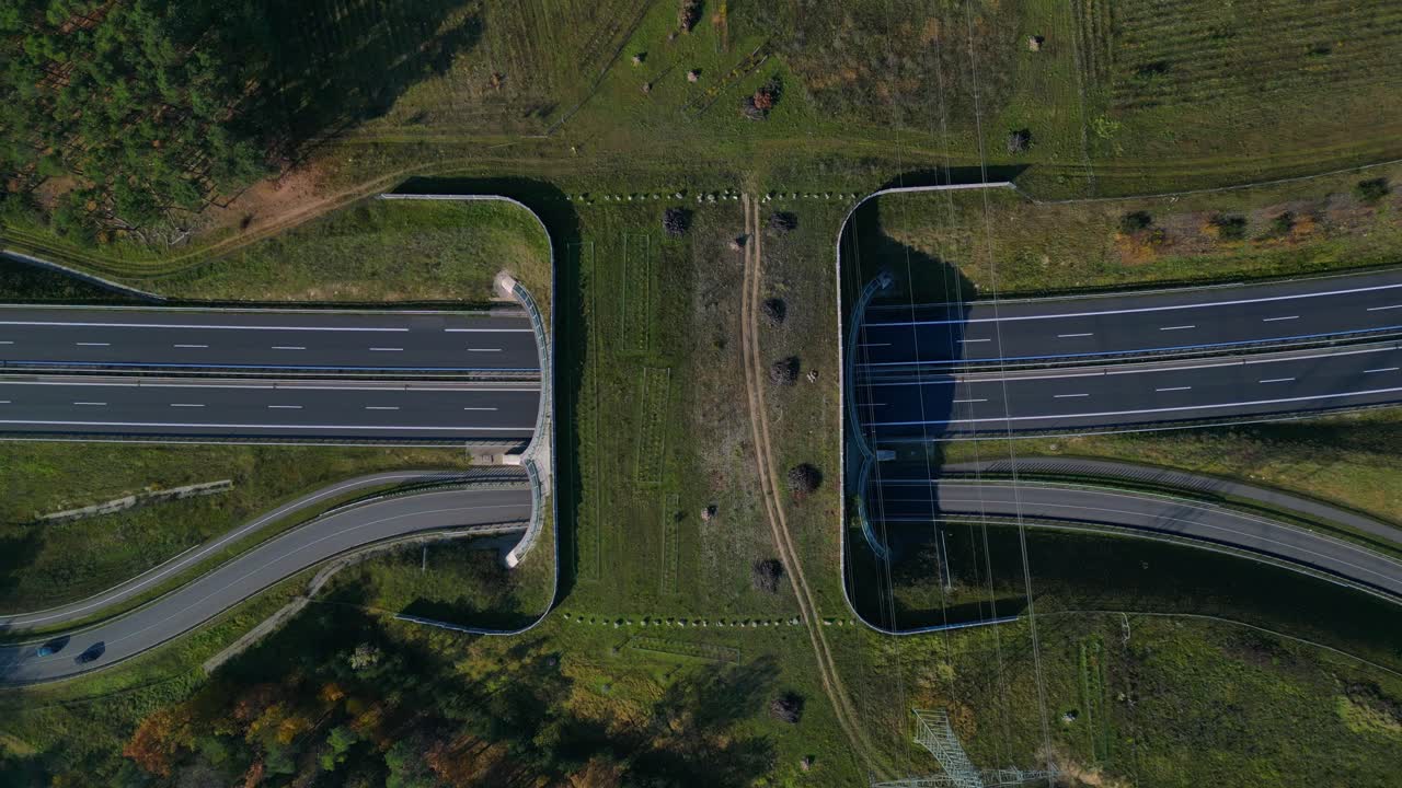 Wildlife crossing over highway in Germany ensuring environmental protection. vertical bird's eye view drone camera pointing down Beautiful aerial view flight overflight flyover drone