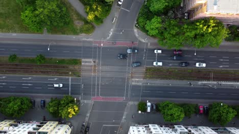 big street, streetcar driving in and out of picture
perfect aerial view flight bird's eye view drone footage
of berlin prenzlauer berg allee summer 2022