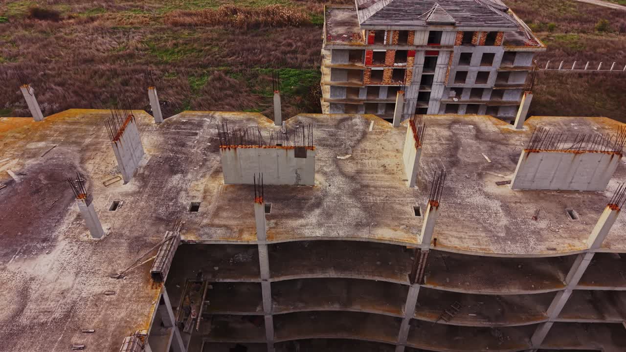 Aerial view of an abandoned construction site showing concrete structure