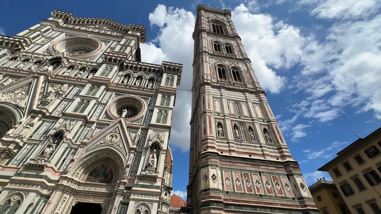 Tilted up low angle view of the Cathedral of Santa Maria under a sky full of clouds, Florence, Italy