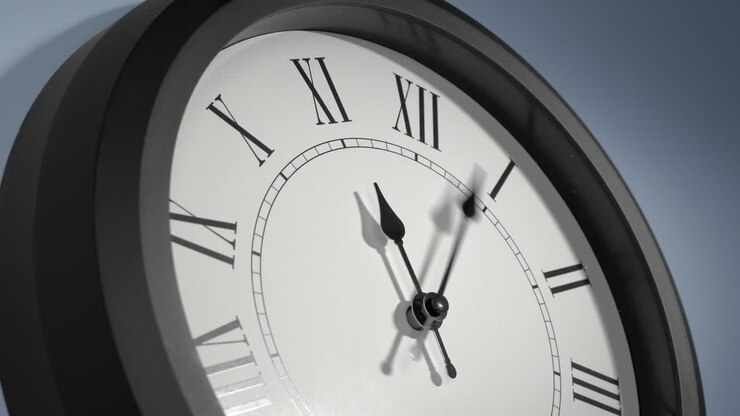 Latin Clock Face on Light Blue Wall in Time Lapse