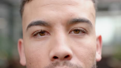 close up portrait of eyes of biracial man at office