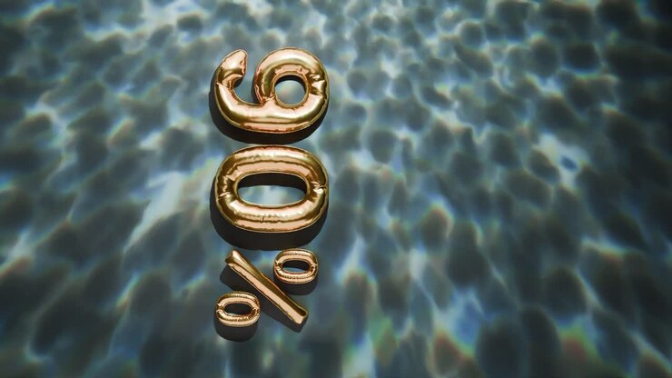 Oro 90% galleggiante sopra increspature d'acqua su sfondo nero verticale