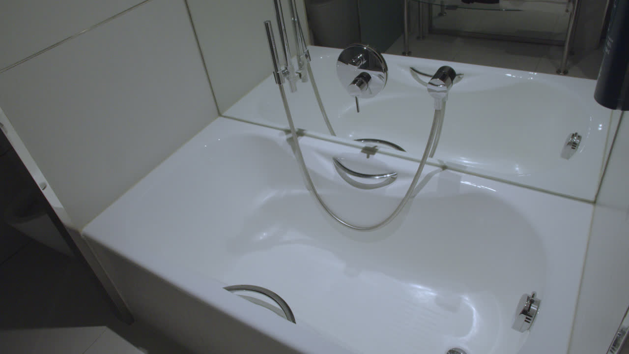 Beautiful general shot in slow motion and with slight movement of the jacuzzi inside a bathroom in a luxury hotel room in Spain.