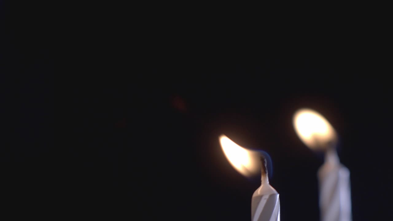 Burning Candle At Night With Reflection On The Mirror On A Dark Room. - close up shot