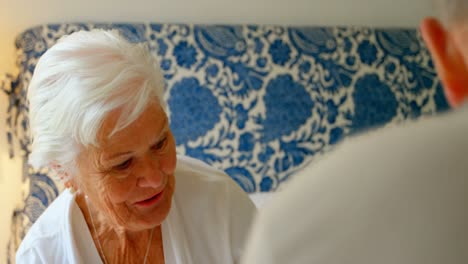 caucasian senior couple interacting with each other in bedroom at comfortable home 4k