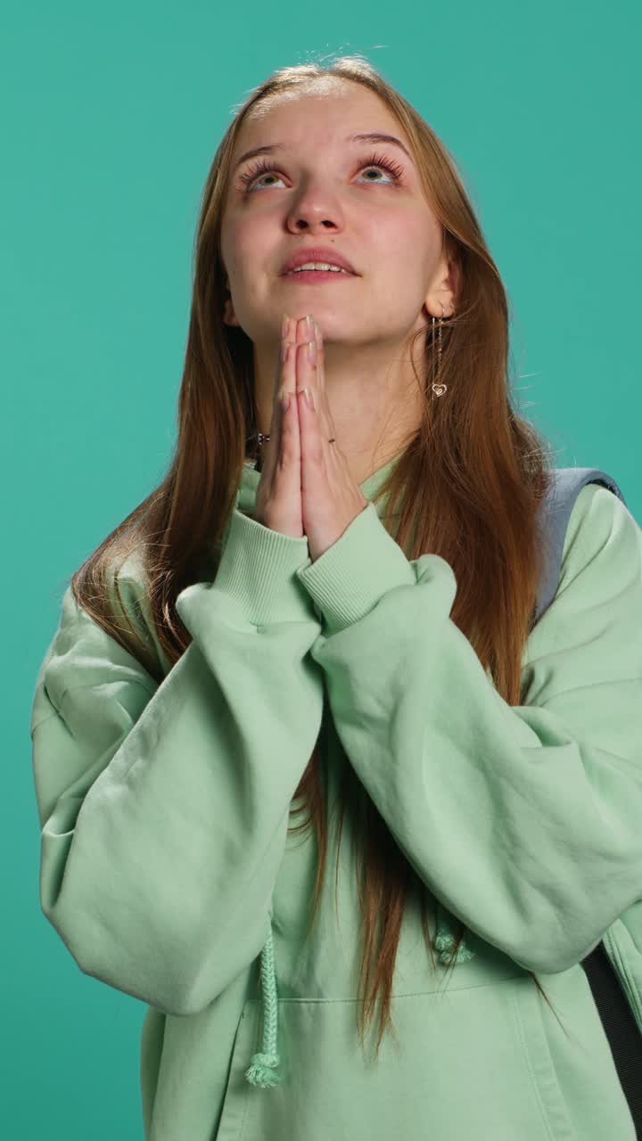 Vertical video Religious teenager doing worship hand gesturing, asking for miracle