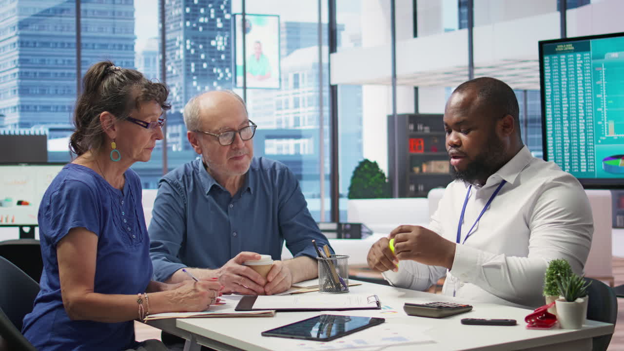 Senior people consulting with their financial banker about retirement plans