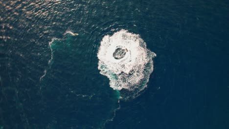 drone over circling jet ski off coastline of cap de creus