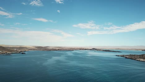 The-Namib-Desert-Dunes-and-the-Atlantic-Ocean-Meets,-Skeleton-Coast,-Southern-Africa-Namibia,-Luderitz-Town-Shark-Island-Aerial-Shot