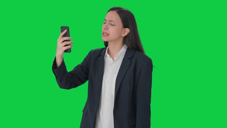 Angry-Indian-female-manager-shouting-on-video-call-Green-screen