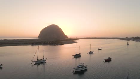 Flying-over-the-Harbor-of-Morro-Bay-California-at-sunset