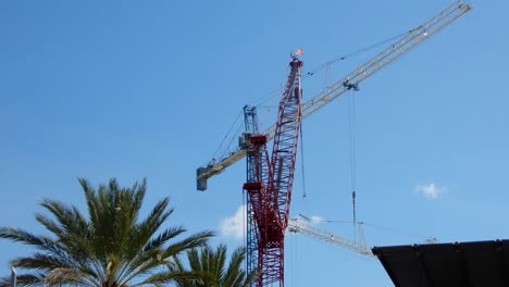 construction crane at a busy  urban construction site