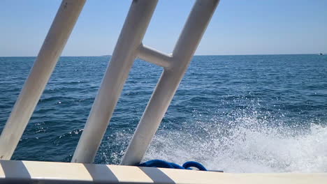 sailing in ocean on sunny day, slow motion. boat passenger pov