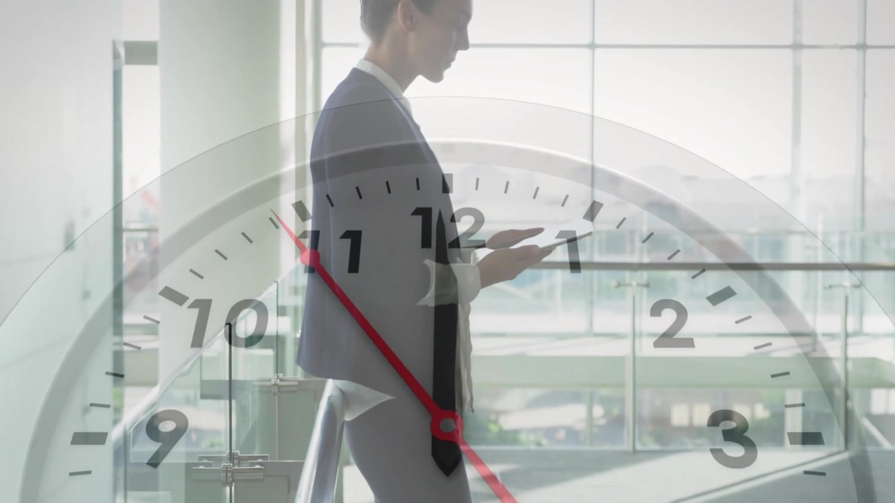 Clock animation over businessperson using tablet in modern office building