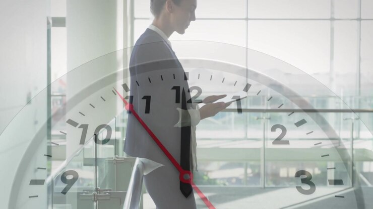 Clock animation over businessperson using tablet in modern office building