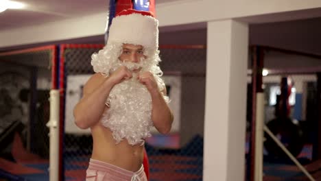 santa claus in boxing gloves trains in the ring santa claus in boxing gloves trains in the ring the concept of the new year