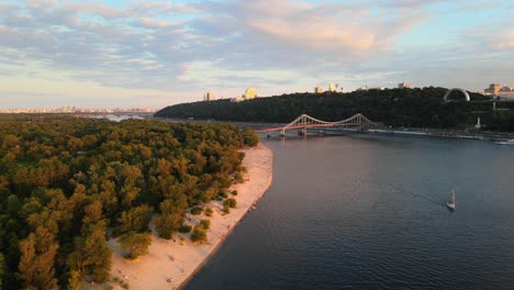 aerial drone view of the dnipro river and a bridge in kiev