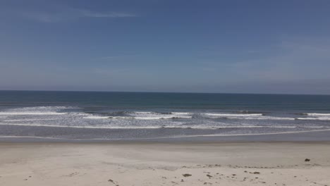 Deserted-beach-waves,-ilha-comprida,-são-paulo,-brazil,-aerial-drone-pan-left