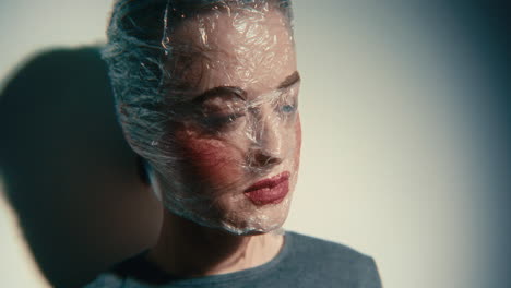 woman with plastic wrap on her head