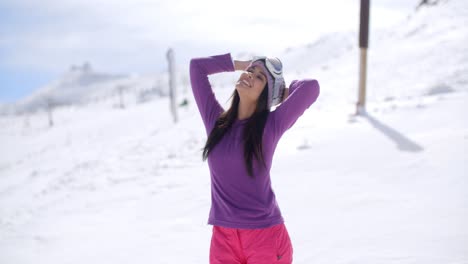 Happy-young-woman-embracing-the-winter-sun