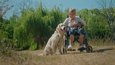 elderly woman in wheelchair with her dog