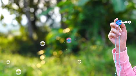 blowing soap bubbles