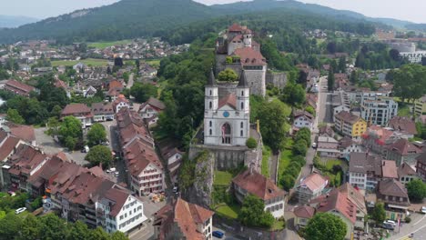 zoomed-out cityscape with historic structures dominating the central ridge
