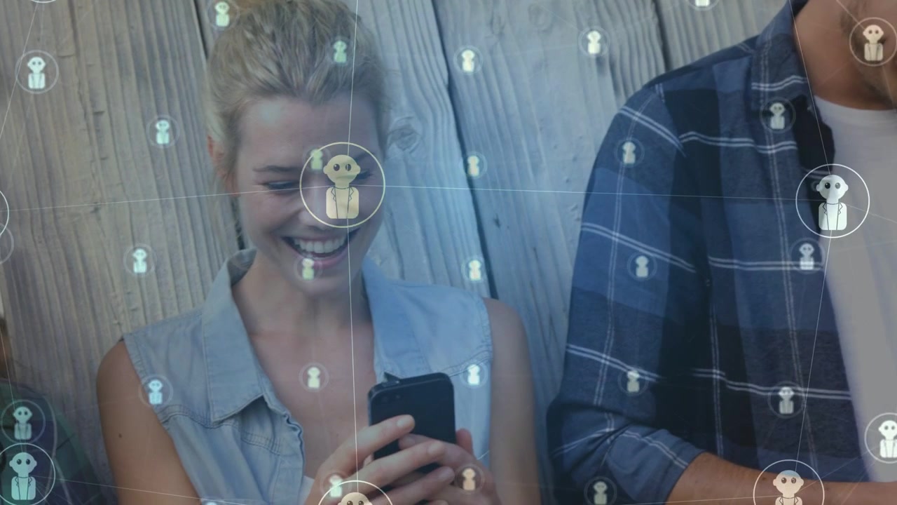 Group standing by plank wall woman entering and tapping phone starting tech overlay causing smiles