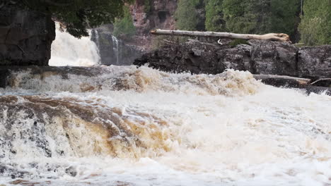 heavy water flows from spring flooding at gooseberry falls